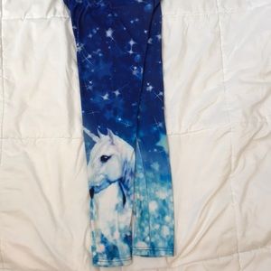 blue leggings that have shining print on them